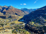 Panoramic view of the village of Allos and the Val d'Allos from Montgros mountain in autumn. View of the village, the leisure park, forests and mountains