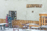 Detail of the restaurant's facade with the wooden sign 