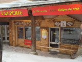The front of the crêperie, a glass facade with specialties displayed: 