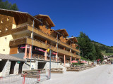 Exterior view of the multi-story residence in La Foux, with terraces