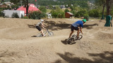 Large dirt track for mountain biking and families, dotted with roundabouts and turns, in a natural setting