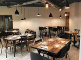 Guest and dining room, dining tables with chairs, high chairs and individual tables, plain decor