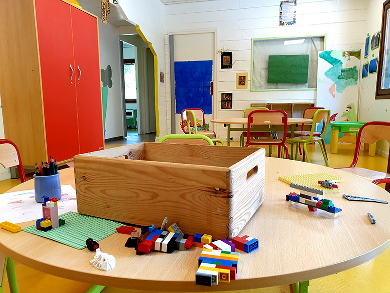 Children's playroom, Lego, tables and chairs, paintings and watercolors on the walls