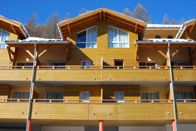 Front view of the upper floors of the residence, with terraces and windows