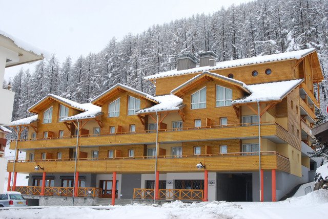 View of the 4-story residence with snow-covered terraces