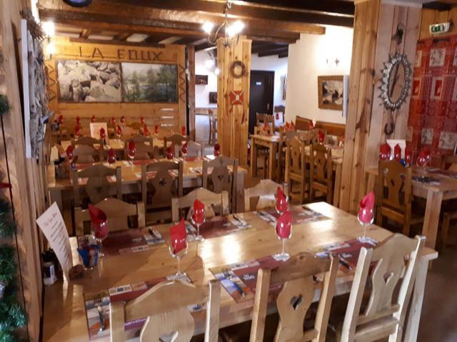 Restaurant dining room, interior decor in wood and mountain style, tables and chairs