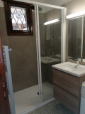 bathroom with bright shower tray, window, ventilation