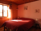 Bright bedroom, double bed, wooden furniture, window