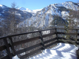 chalet balcony, open view, snow-capped nature and mountains