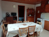 living room with kitchen, TV, chamber entry