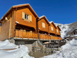 Three-storey wooden chalets, ground floor with personal garage, 1st floor with wooden terraces and fences