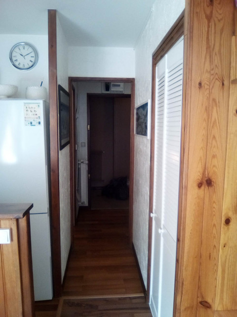Flat hallway, wooden furniture and panelling