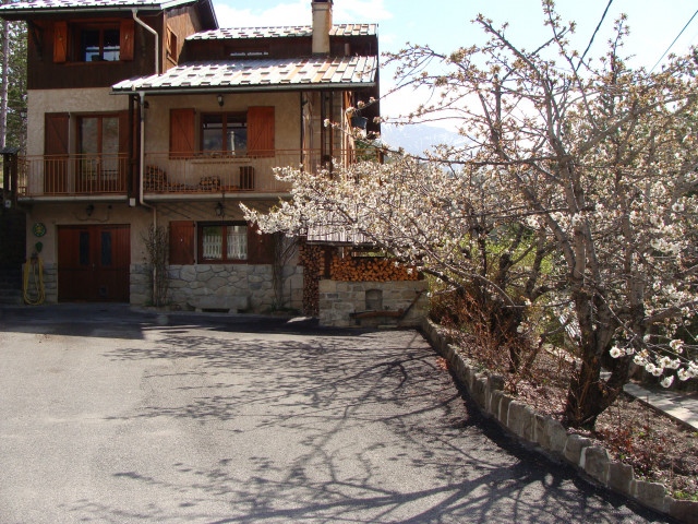 Front view of three-storey wooden and stone house, courtyard, flowering tree - © Dubois Sicard M Front view of three-storey wooden and stone house, courtyard, flowering tree