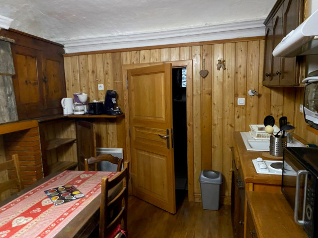 All-in-one apartment living room, kitchenette, dining table, wooden furniture