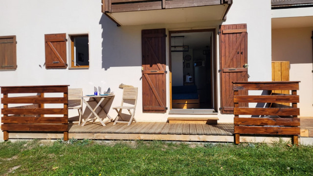 View from the studio's sunny wooden terrace, outdoor tables and chairs